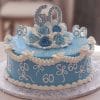 The BD-042 is a round blue cake adorned with white icing, white ruffles, blue and white roses, and multiple "60"s, including a large "60" topper—perfect for celebrating a 60th birthday.