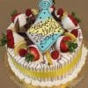 The FD-009 Gold cake features a round shape with chocolate shavings, lemon slices, and strawberries—some dipped in white chocolate. A blue tie-shaped plaque says "Happy Fathers Day." The gold cake has a lemon and raspberry mousse filling and sits on a gold board.