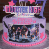 The CB-010D is a purple Monster High birthday cake with pink stars, black bats, a big number 7, and characters from Monster High: The Movie. "Happy 8th Birthday Brylee" is written on top.