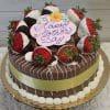 The MD-004 Chocolate Oreo Cake features chocolate-dipped strawberries, white icing, a yellow ribbon, and a pink plaque with "Happy Mothers Day" in purple icing, presented on a gold cake board.