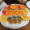 The CE-090b Fall Sugar Cookies set features leaf, acorn, and pumpkin sugar cookies on a white plate, decorated in festive fall colors like yellow, orange, red, green, and brown.
