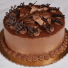 The BD-001B Tiramisu, a round cake with smooth chocolate frosting, chocolate shavings, and decorative chocolate pieces, is presented on a gold cake board against a marble background.