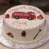 The CB-027B is a round birthday cake decorated with a fire truck, hydrant, fire, helmet, and axe. Red icing reads “Happy 27th Birthday Keith.” The cake is presented on a silver-patterned board.