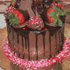 The VC-014A 6" Chocolate Cake/Chocolate Mousse features chocolate-covered strawberries, chocolate curls, heart-shaped sprinkles, and ganache drip. Presented on a gold board with pink and white sprinkles around the base.