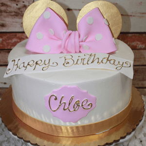 The CB-001G cake is white with a gold ribbon base, topped with gold mouse ears and a pink polka-dot bow. "Happy Birthday" is written on the cake, along with a plaque featuring "Chloe" in gold.
