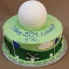 A round ST-007B Golf Ball birthday cake topped with a large white golf ball, green icing, blue and white flags, clouds, golf clubs, and "Happy 50th Birthday Joe" written in blue icing.