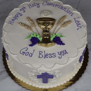 RC-001K is a round white cake featuring a gold chalice, wheat, grapes, and leaves, with “Happy 1st Holy Communion Leah. God Bless you.” on top. Purple crosses and white designs decorate the sides.